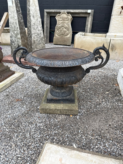 Pair of Cast Iron Urns on Stone Plinths