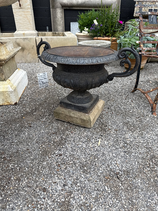 Pair of Cast Iron Urns on Stone Plinths