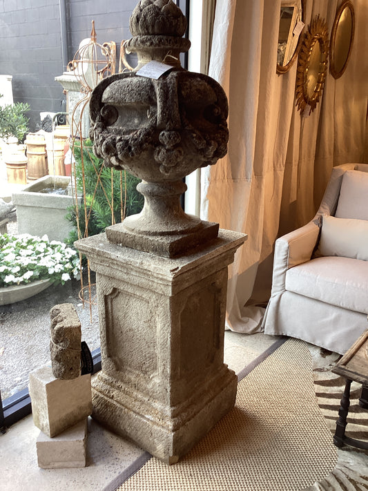 Stone Urn with finial atop a stone base
