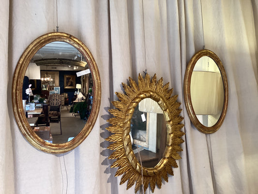 Pair of French Louis Philippe gold leaf oval mirrors